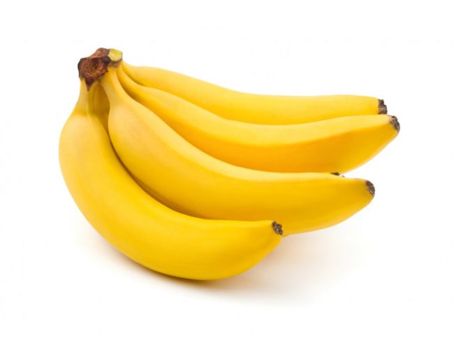 Жёлтые бананы на белом фоне