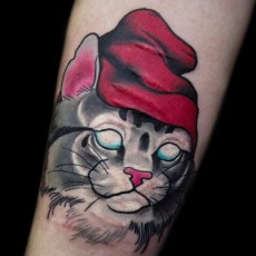 Татуировка на женском предплечье - кот 
